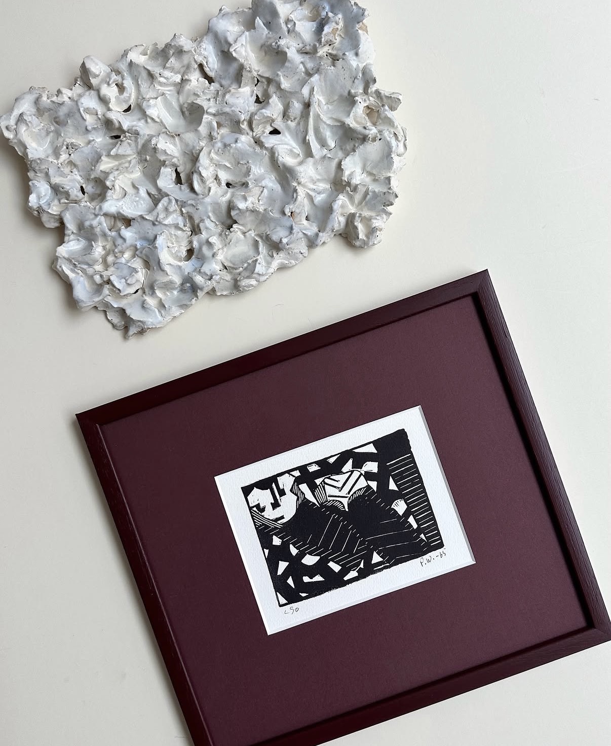 Framed graphic print and sculptural wall piece from the gallery's curated collection