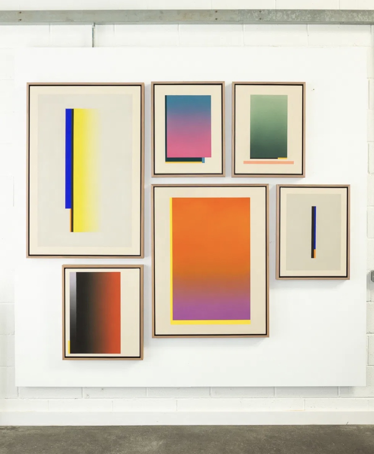 A curated wall display of George Stuttard's framed original works